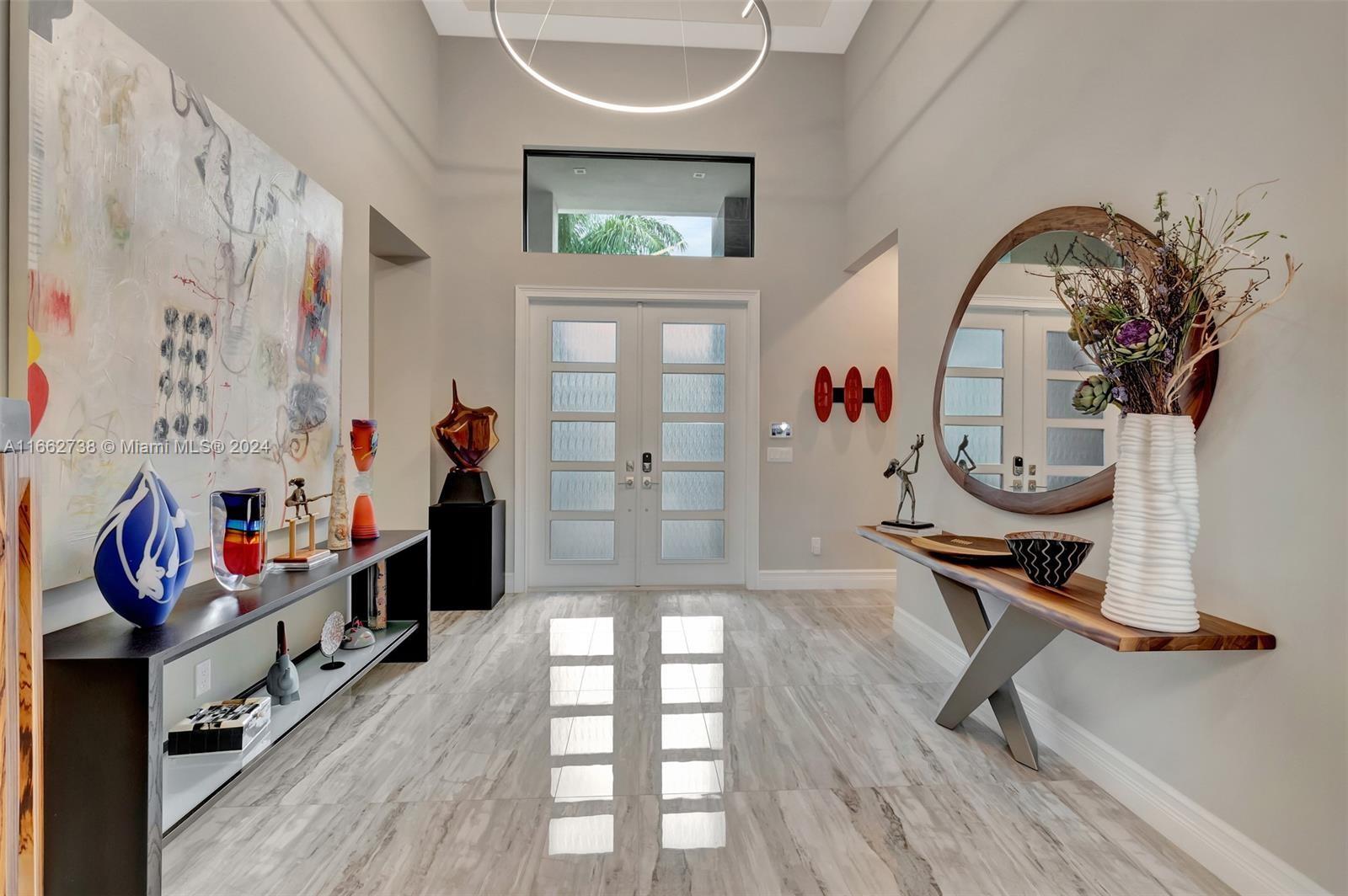 17430 Rosella Road Boca Raton, FL 33496 - Photo 2 of 23 a view of an entryway with wooden floor