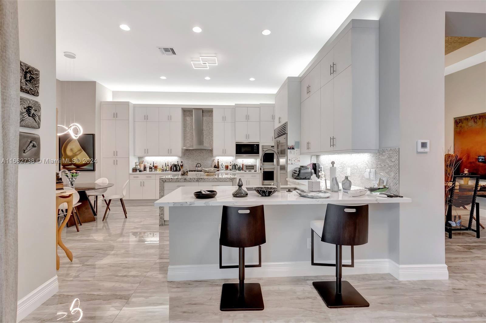 17430 Rosella Road Boca Raton, FL 33496 - Photo 4 of 23 a kitchen with stainless steel appliances lots of counter top space