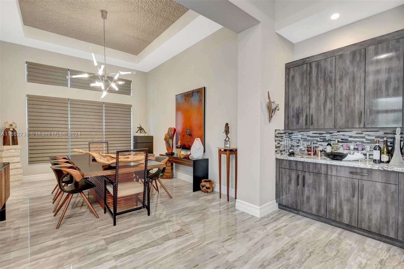 17430 Rosella Road Boca Raton, FL 33496 - Photo 9 of 23 a dining room with furniture and window