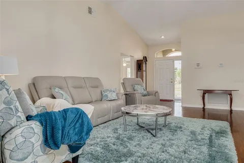 a living room with furniture and a rug