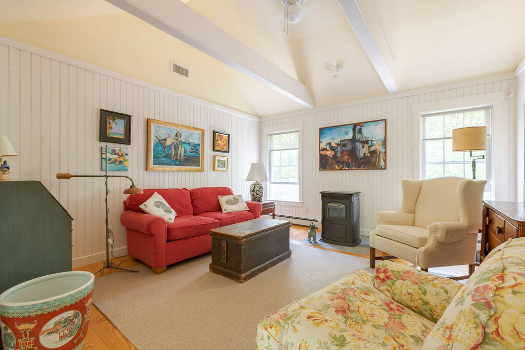 30 Amy's Way Wellfleet, MA 02667 - Photo 19 of 64 a living room with furniture and a fireplace