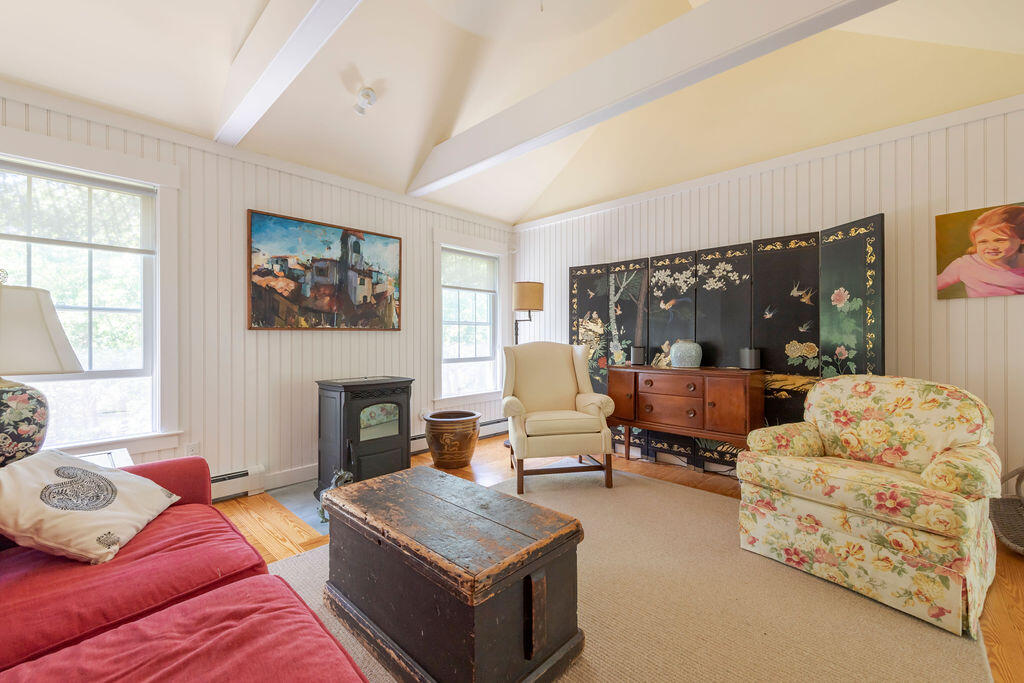 30 Amy's Way Wellfleet, MA 02667 - Photo 3 of 64 a living room with furniture and a fireplace