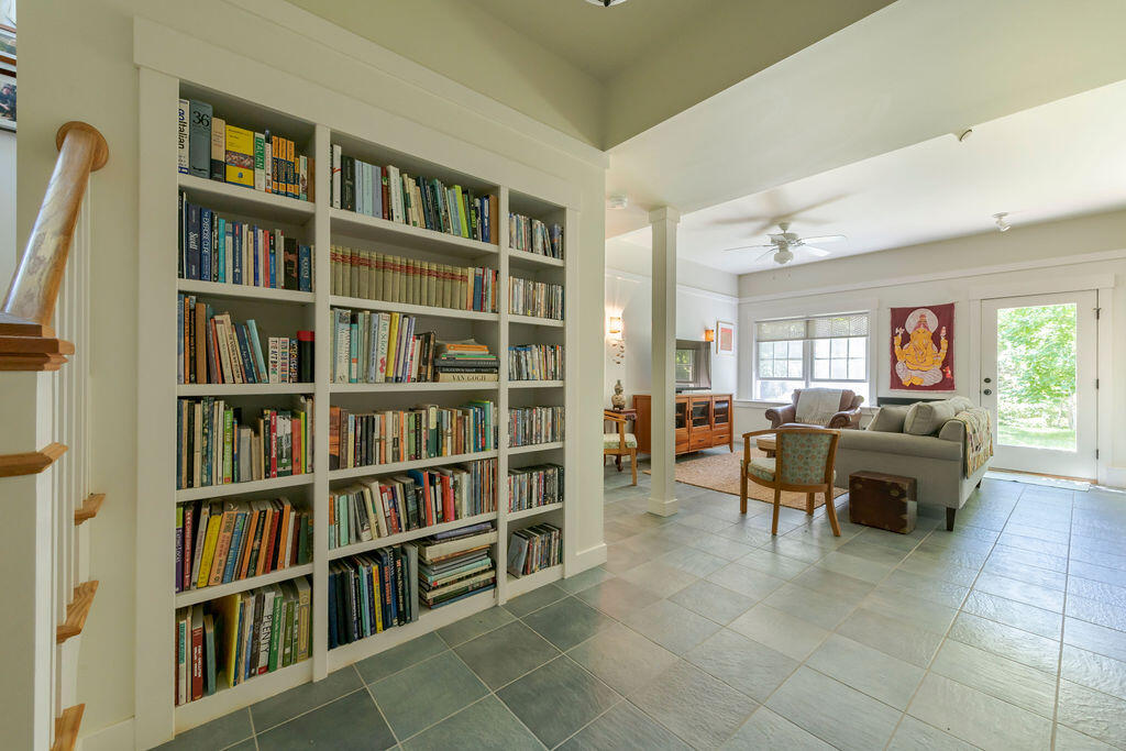 30 Amy's Way Wellfleet, MA 02667 - Photo 35 of 64 a living room with furniture and a book shelf
