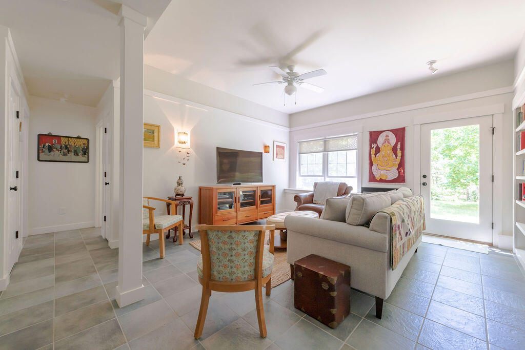 30 Amy's Way Wellfleet, MA 02667 - Photo 36 of 64 a living room with furniture a flat screen tv and a window