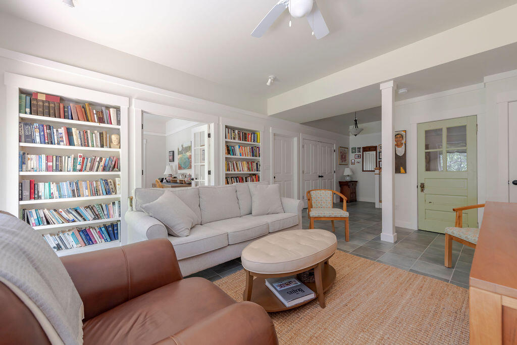 30 Amy's Way Wellfleet, MA 02667 - Photo 38 of 64 a living room with furniture and a book shelf