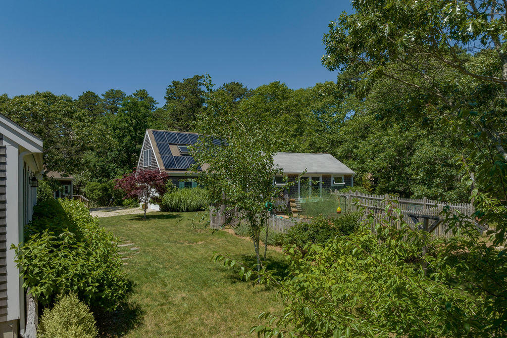 30 Amy's Way Wellfleet, MA 02667 - Photo 49 of 64 a view of a garden with plants and large trees