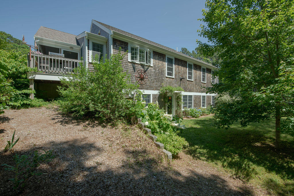 30 Amy's Way Wellfleet, MA 02667 - Photo 6 of 64 a front view of a house with a yard and trees