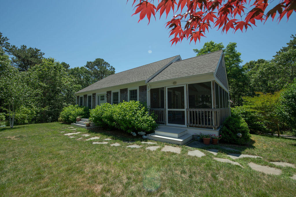30 Amy's Way Wellfleet, MA 02667 - Photo 7 of 64 a front view of a house with a yard