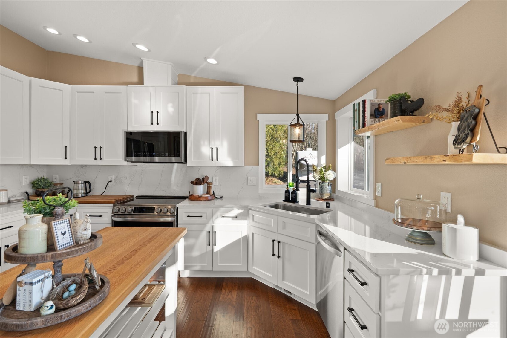 107 Odella Lane Chehalis, WA 98532 - Photo 11 of 37 a kitchen with white cabinets and appliances