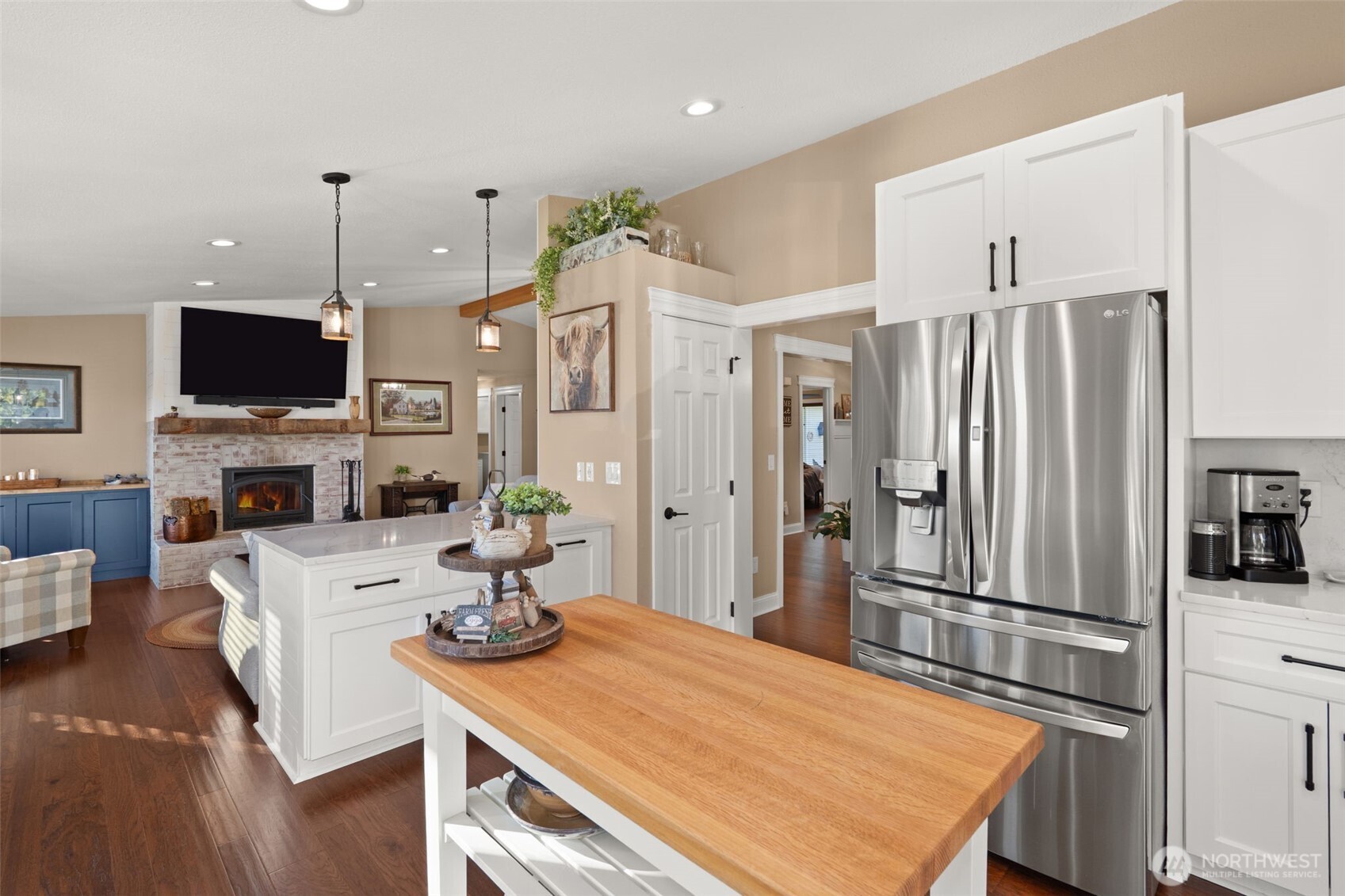 107 Odella Lane Chehalis, WA 98532 - Photo 12 of 37 a kitchen with stainless steel appliances granite countertop a refrigerator a oven a sink a stove and a dining table with wooden floor