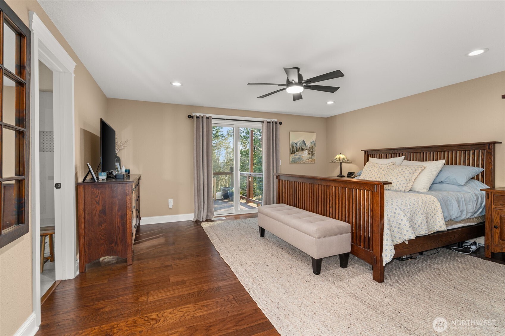 107 Odella Lane Chehalis, WA 98532 - Photo 15 of 37 a spacious bedroom with a bed and a flat screen tv