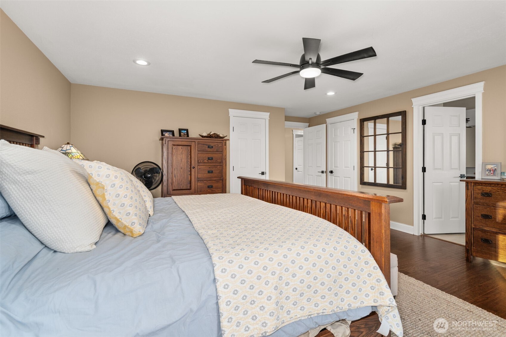 107 Odella Lane Chehalis, WA 98532 - Photo 16 of 37 a bedroom with a large bed and a chandelier