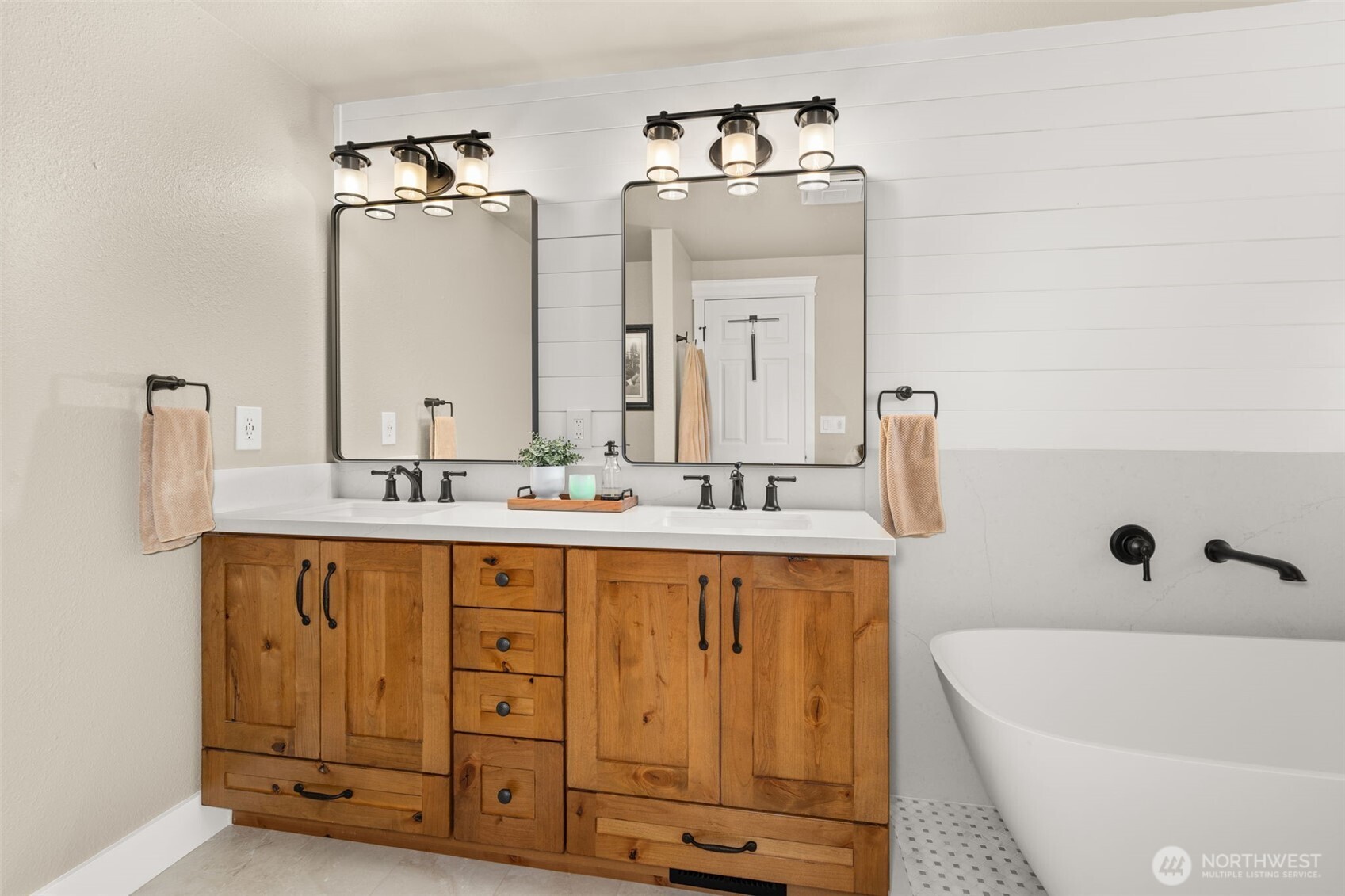 107 Odella Lane Chehalis, WA 98532 - Photo 17 of 37 a bathroom with a double vanity sink a mirror and bathtub