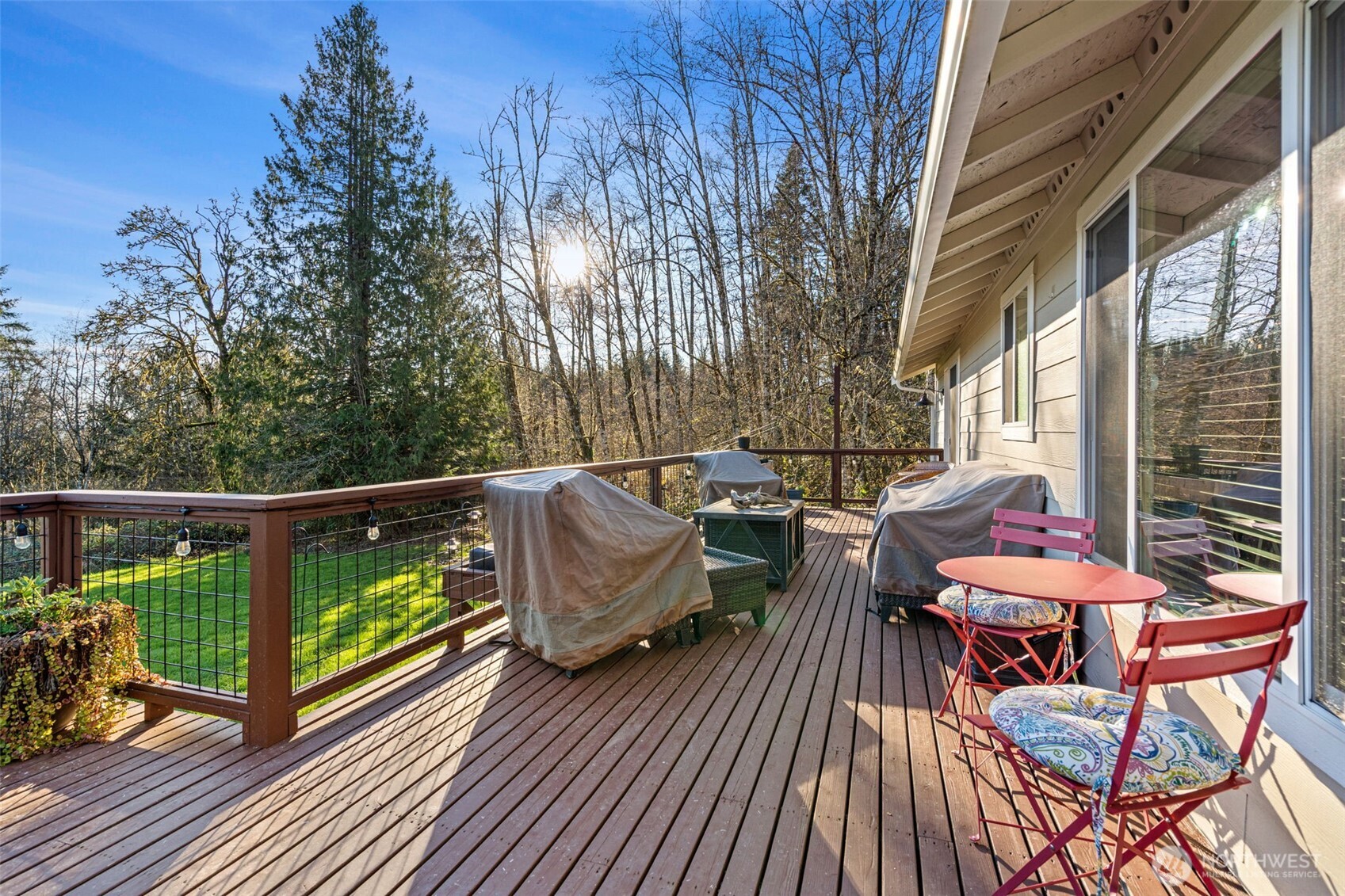 107 Odella Lane Chehalis, WA 98532 - Photo 26 of 37 a balcony with wooden floor table and chairs