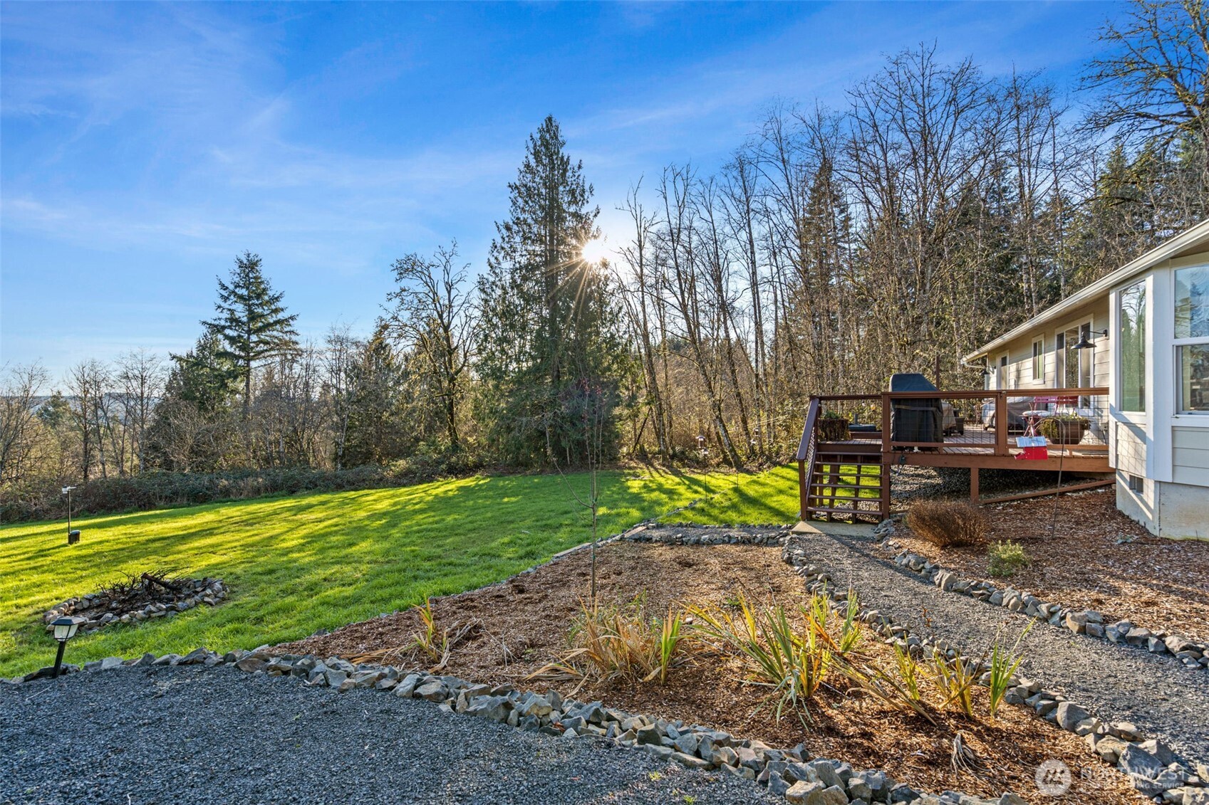 107 Odella Lane Chehalis, WA 98532 - Photo 28 of 37 a view of a backyard with plants and a slide