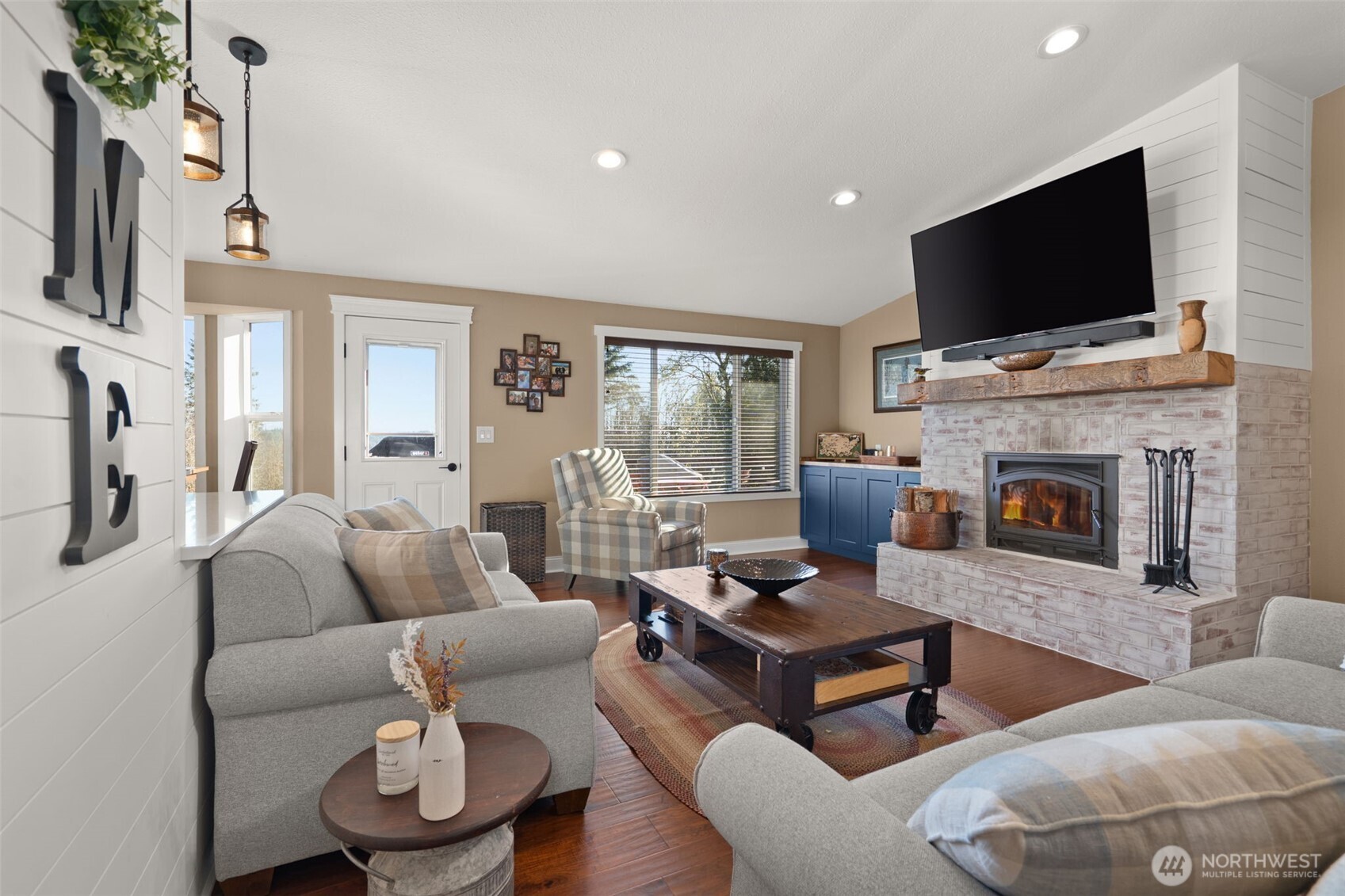 107 Odella Lane Chehalis, WA 98532 - Photo 7 of 37 a living room with furniture a flat screen tv and a fireplace