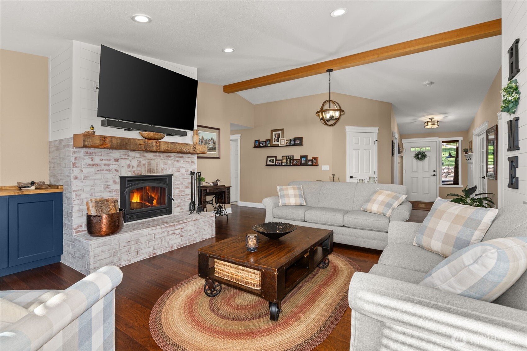 107 Odella Lane Chehalis, WA 98532 - Photo 9 of 37 a living room with furniture a flat screen tv and a fireplace