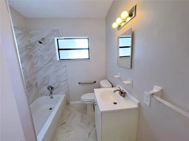 a view of a yard with swimming pool