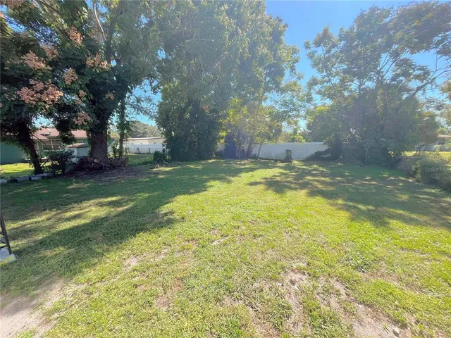 a view of a house with a big yard