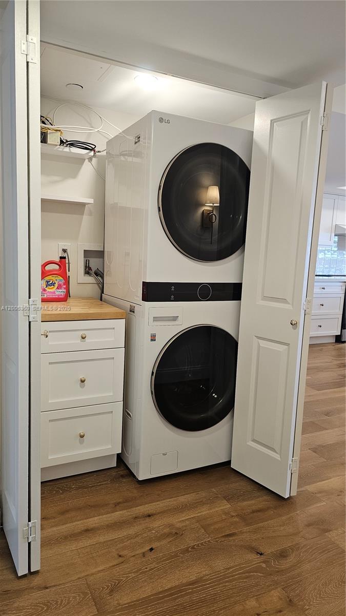 4001 North Ocean Boulevard, Unit 702 Boca Raton, FL 33431 - Photo 18 of 56 a view of a storage and utility room with a washer dryer