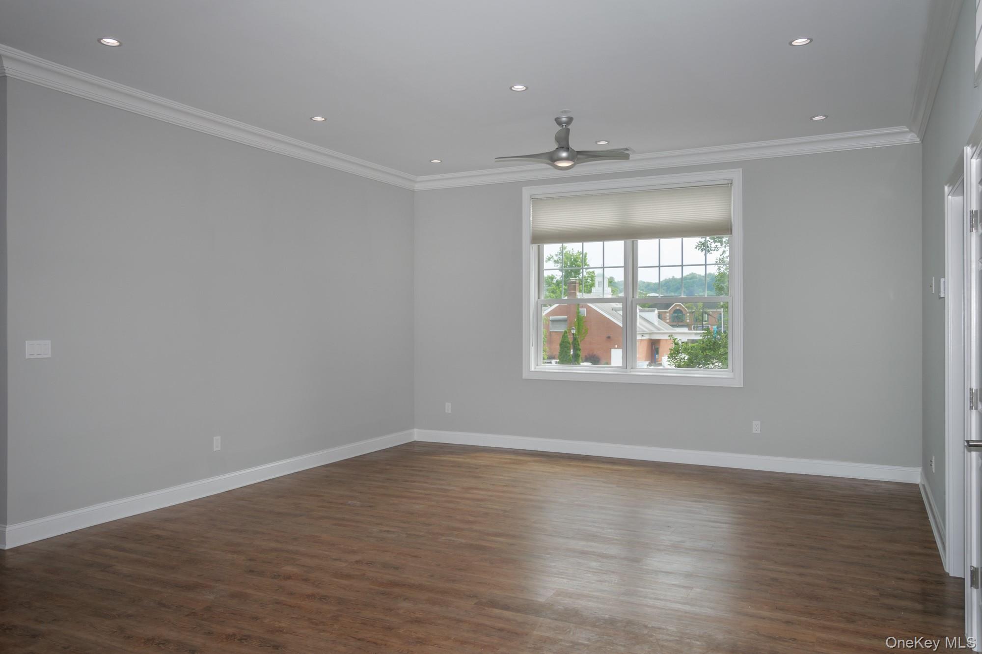2 Union Place, Unit 3F Huntington, NY 11743 - Photo 5 of 11 an empty room with wooden floor and windows