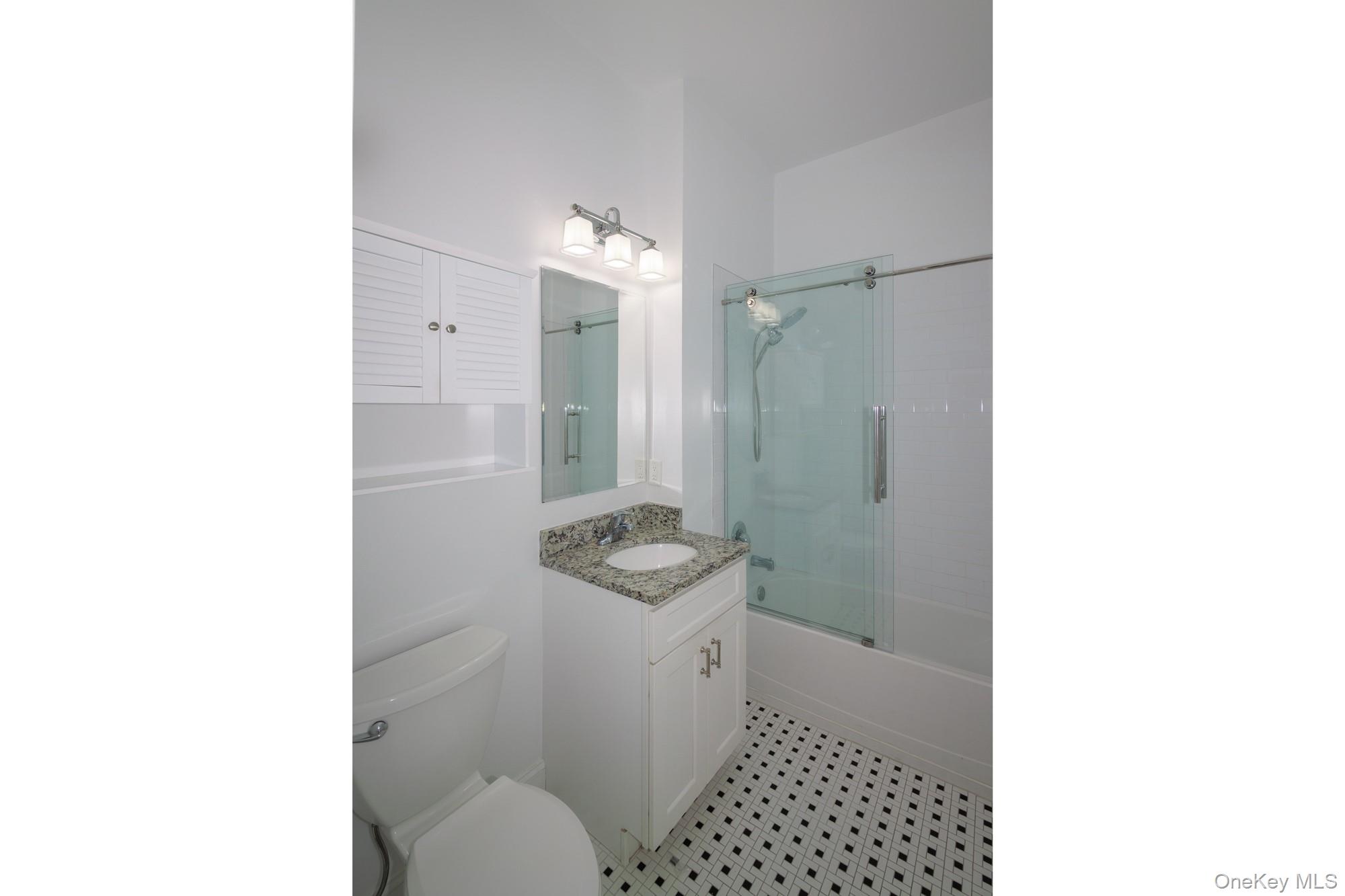 2 Union Place, Unit 3F Huntington, NY 11743 - Photo 10 of 11 a bathroom with a sink toilet and shower