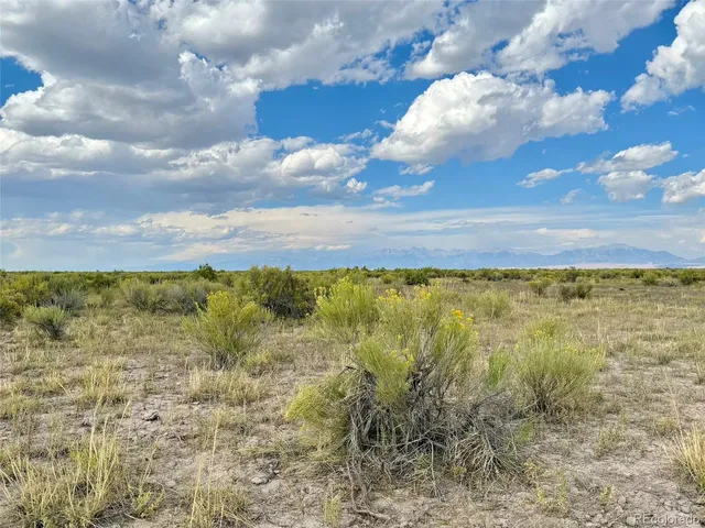 a view of a lake with houses in the back