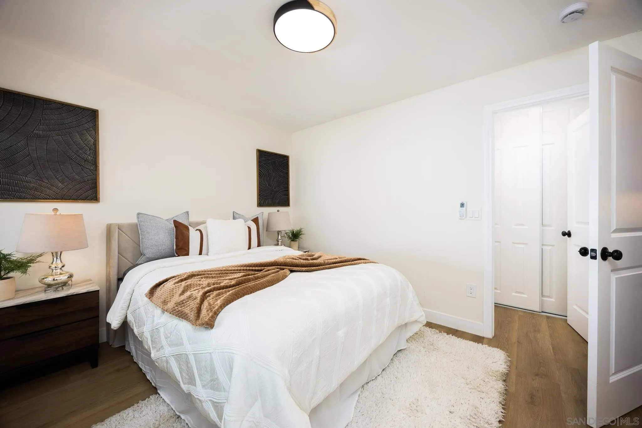 678 Robby Way Fallbrook, CA 92028 - Photo 13 of 36 a bedroom with bed and flat screen tv