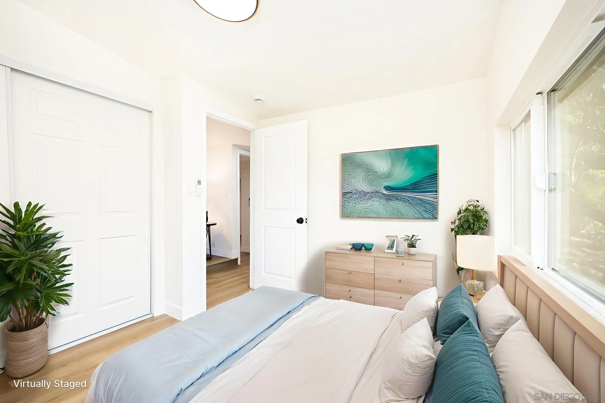 678 Robby Way Fallbrook, CA 92028 - Photo 18 of 36 a bedroom with a bed and a flat screen tv