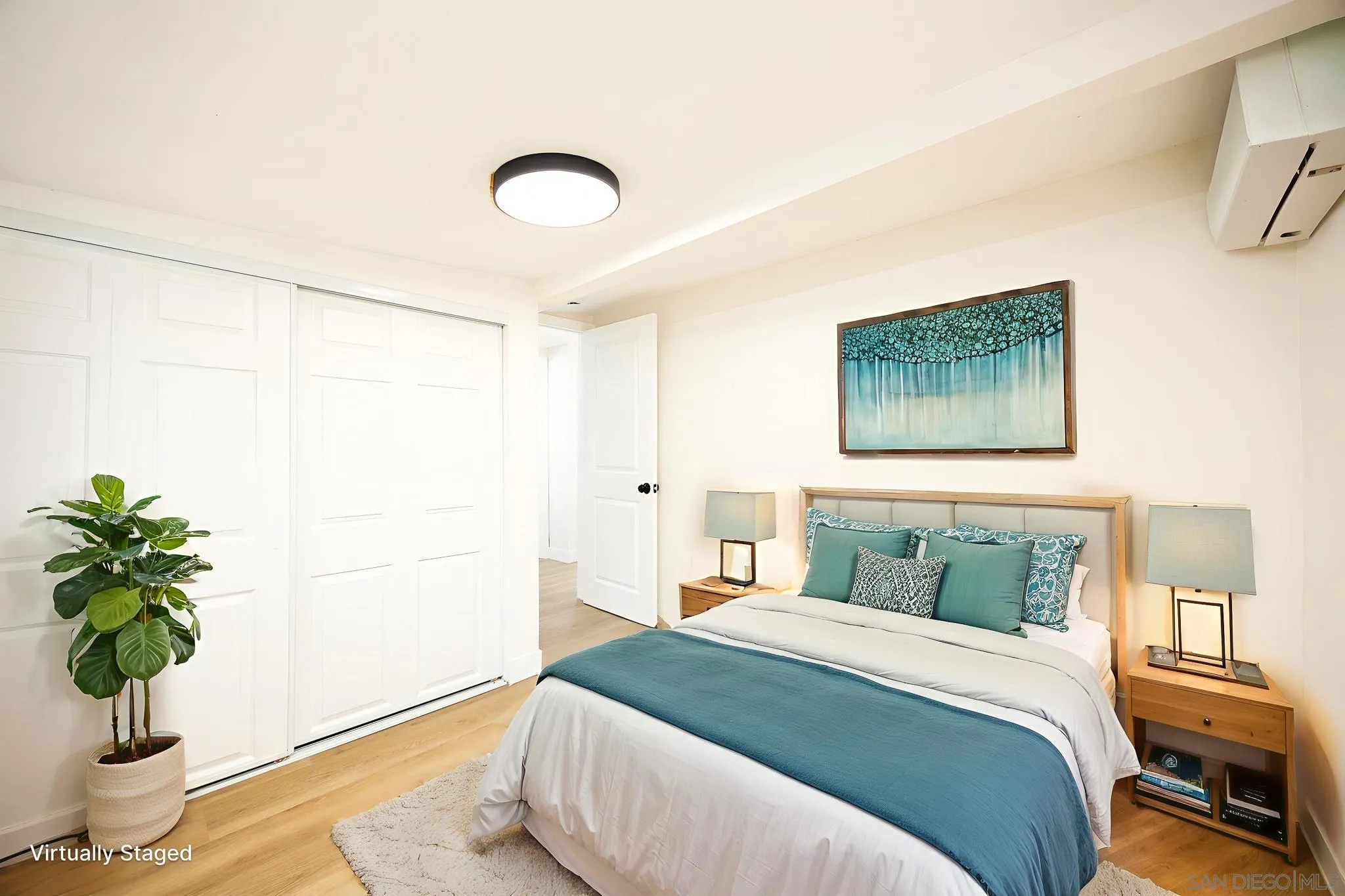 678 Robby Way Fallbrook, CA 92028 - Photo 23 of 36 a bedroom with a bed and a potted plant