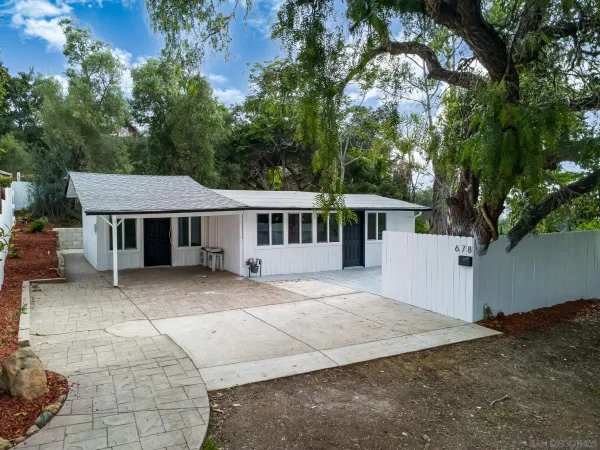 a house with trees in the background