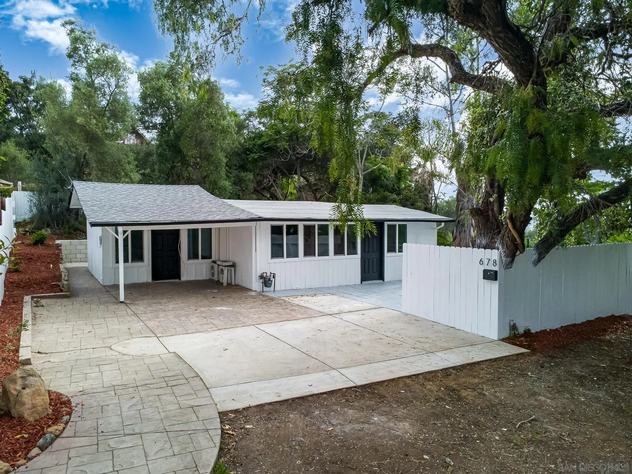 678 Robby Way Fallbrook, CA 92028 - Photo 25 of 36 a house with trees in the background