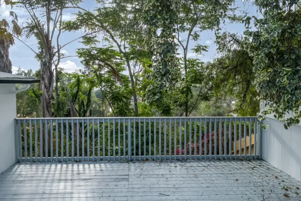 an aerial view of a house with outdoor space
