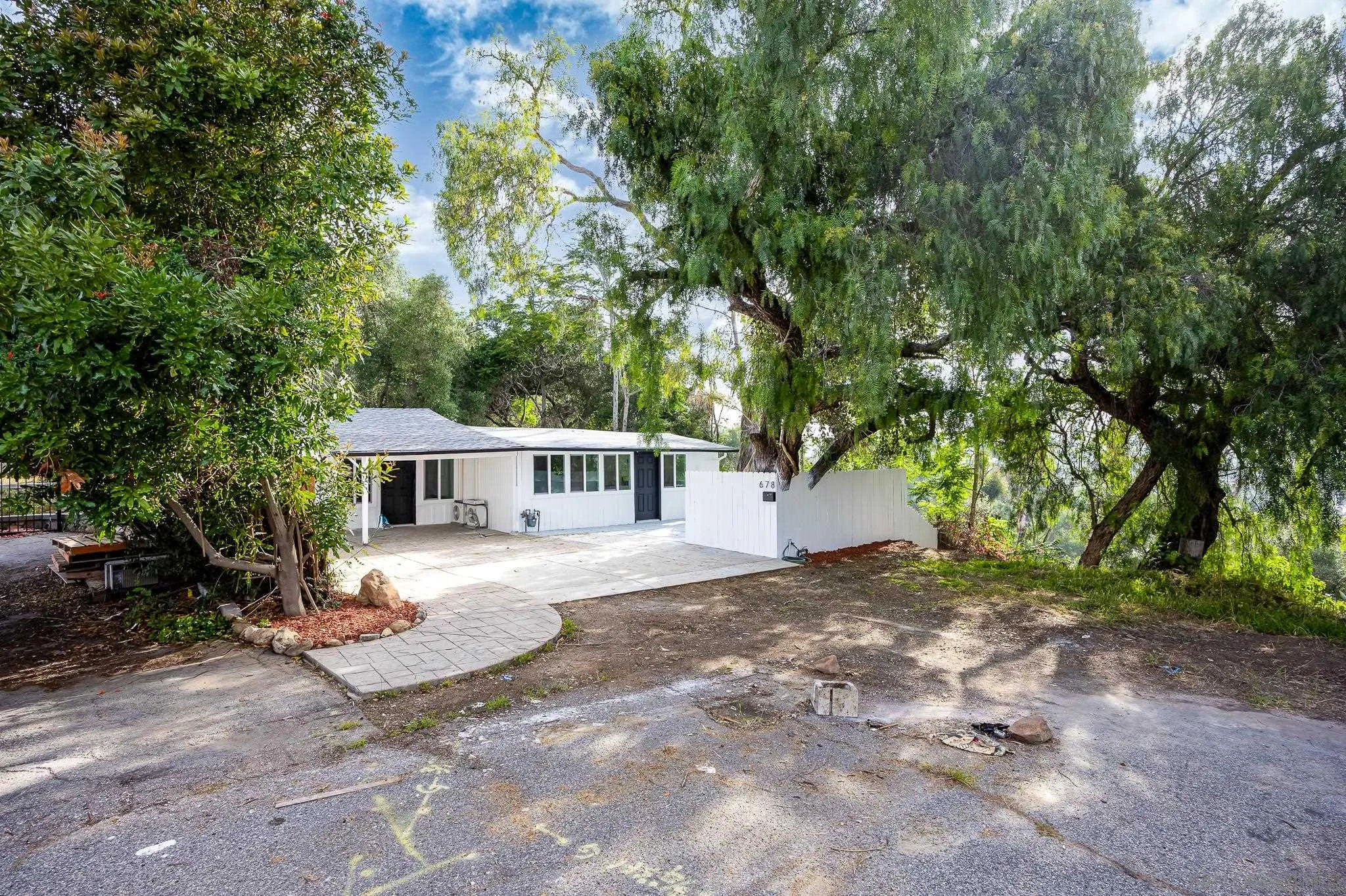 678 Robby Way Fallbrook, CA 92028 - Photo 34 of 36 a view of a house with a tree in front of it
