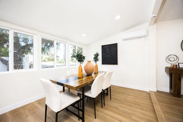 a view of a dining room with furniture window and wooden floor