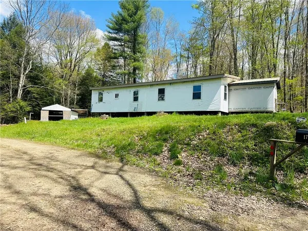 a view of a back yard of the house