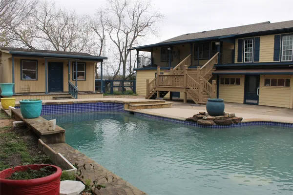 a front view of a house with swimming pool