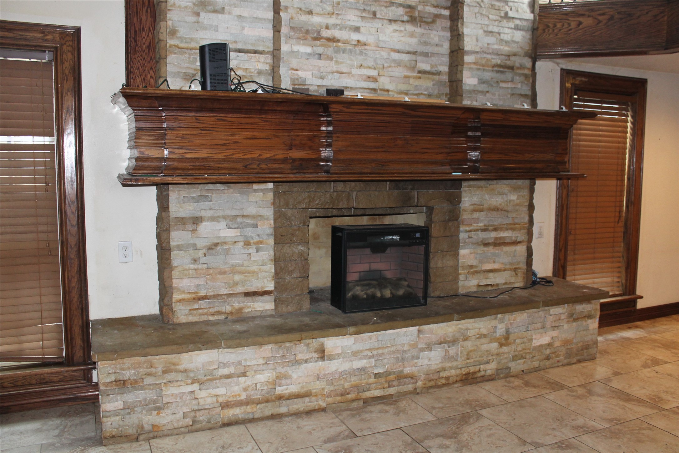 1111 Spur 529 Rosenberg, TX 77471 - Photo 13 of 41 a living room with a fireplace