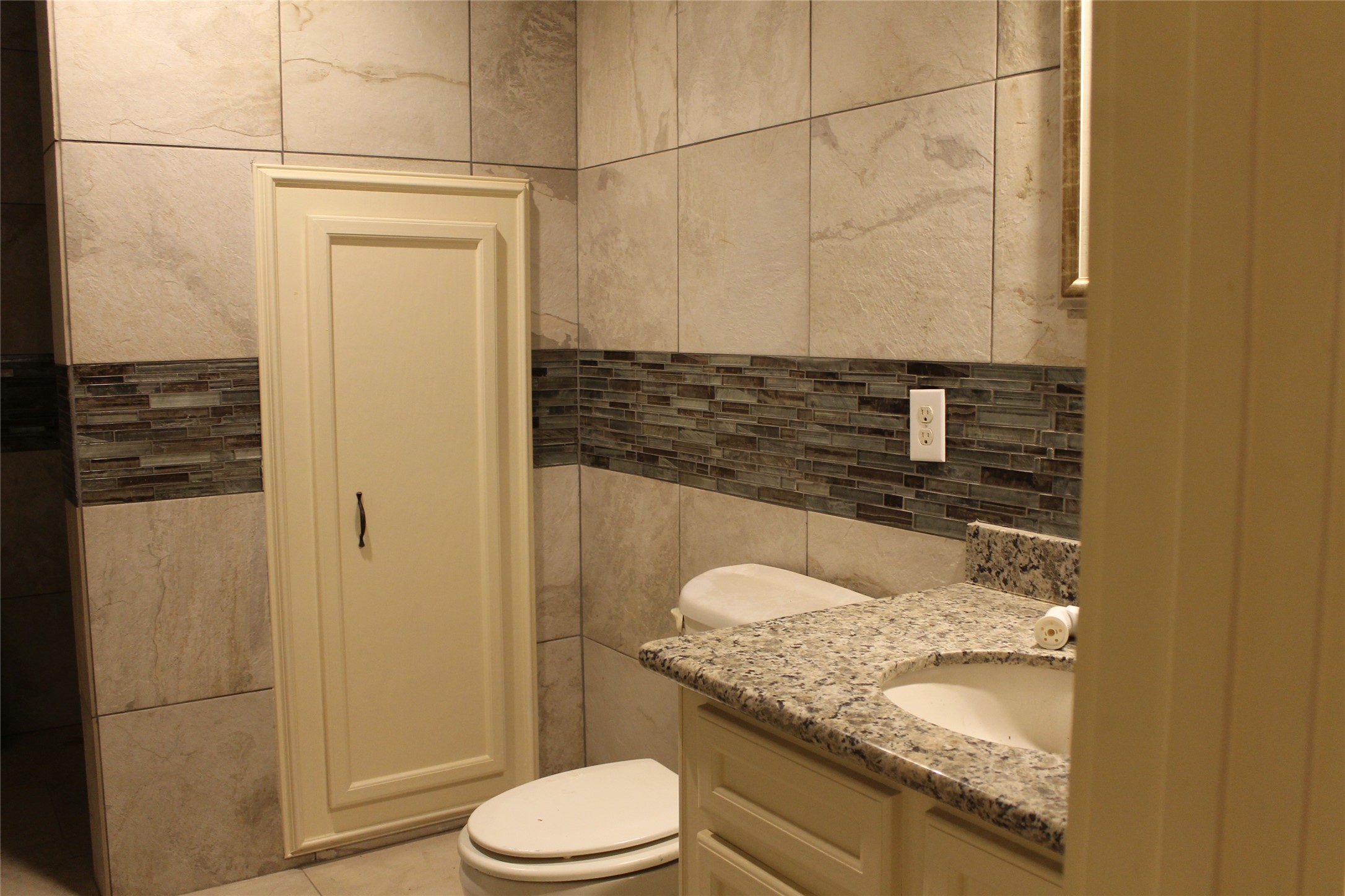 1111 Spur 529 Rosenberg, TX 77471 - Photo 21 of 41 a bathroom with a granite countertop sink a toilet and shower