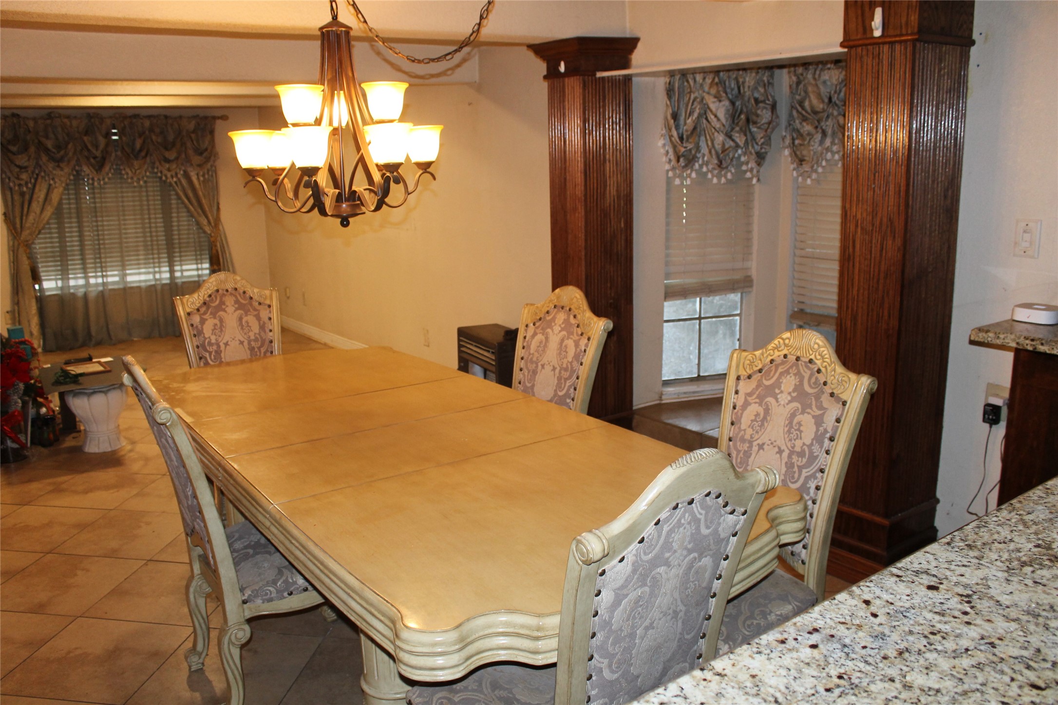 1111 Spur 529 Rosenberg, TX 77471 - Photo 8 of 41 a room with a bed and chandelier