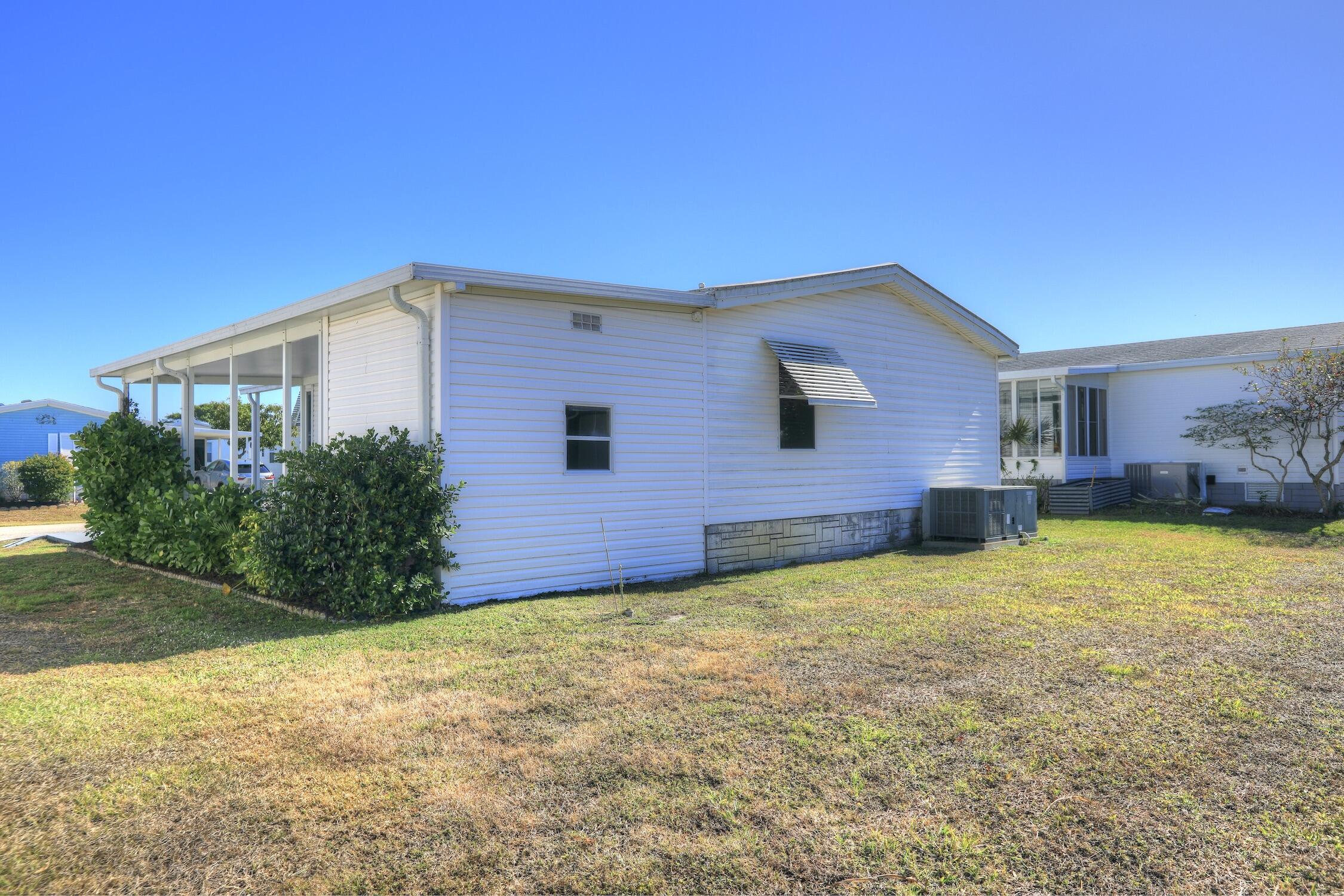 7576 Chasta Road Micco, FL 32976 - Photo 19 of 27 a view of a backyard of a house