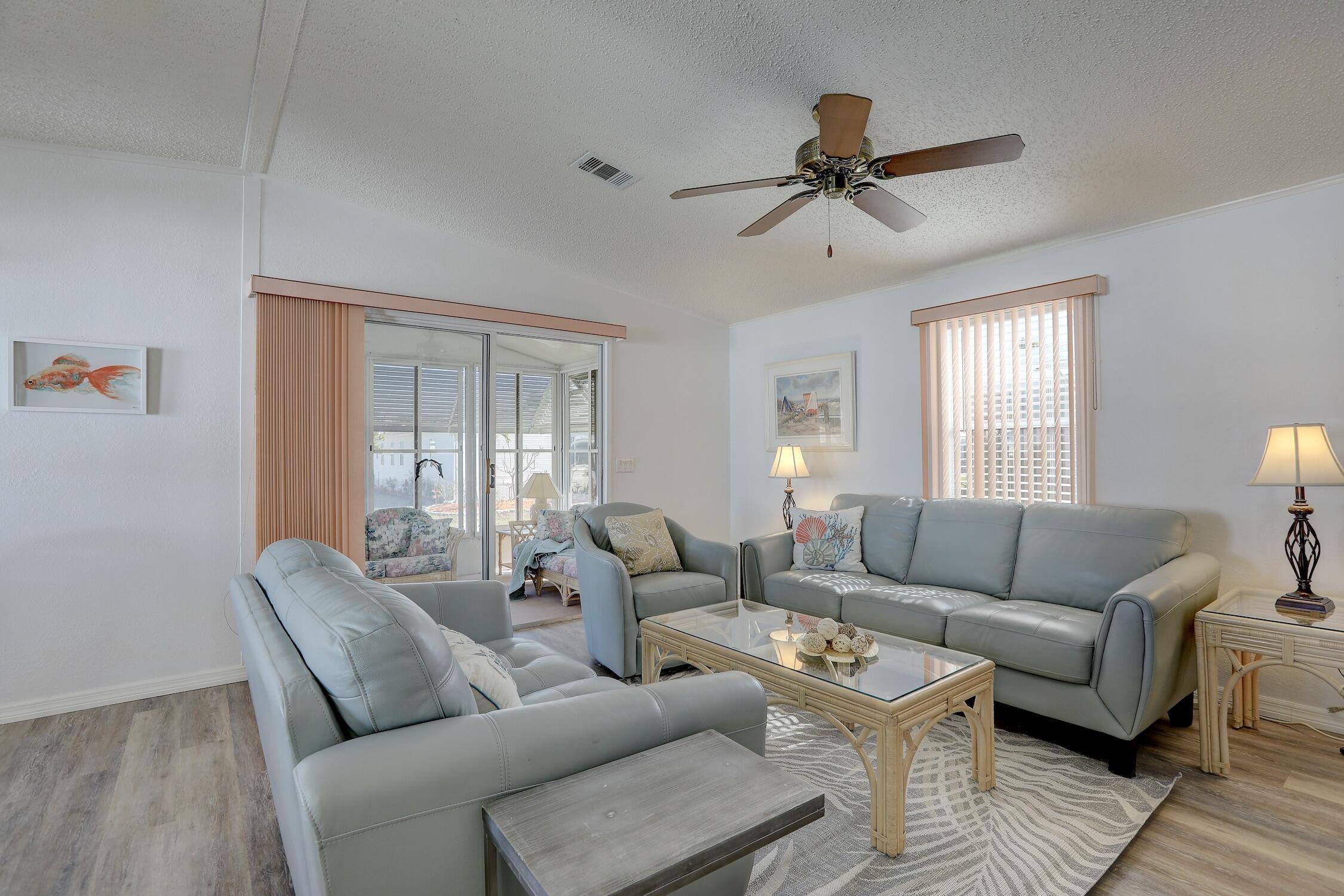 7576 Chasta Road Micco, FL 32976 - Photo 4 of 27 a living room with furniture and a window