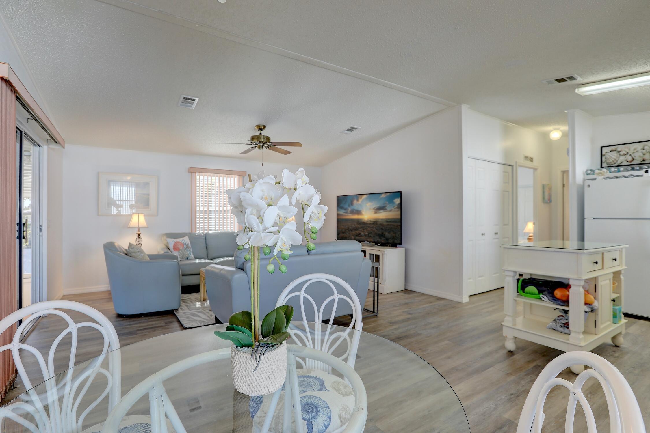 7576 Chasta Road Micco, FL 32976 - Photo 6 of 27 a living room with furniture fireplace and flat screen tv