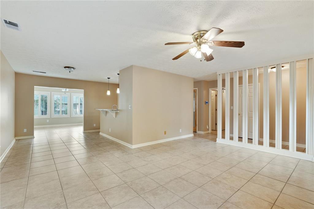 2949 Torreya Way Southeast Marietta, GA 30067 - Photo 5 of 23 an empty room with fan and windows