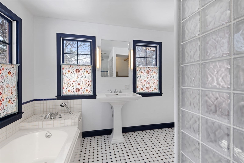 2 Spingler Way Hamilton, MA 01982 - Photo 33 of 40 a bathroom with a bathtub sink and mirror