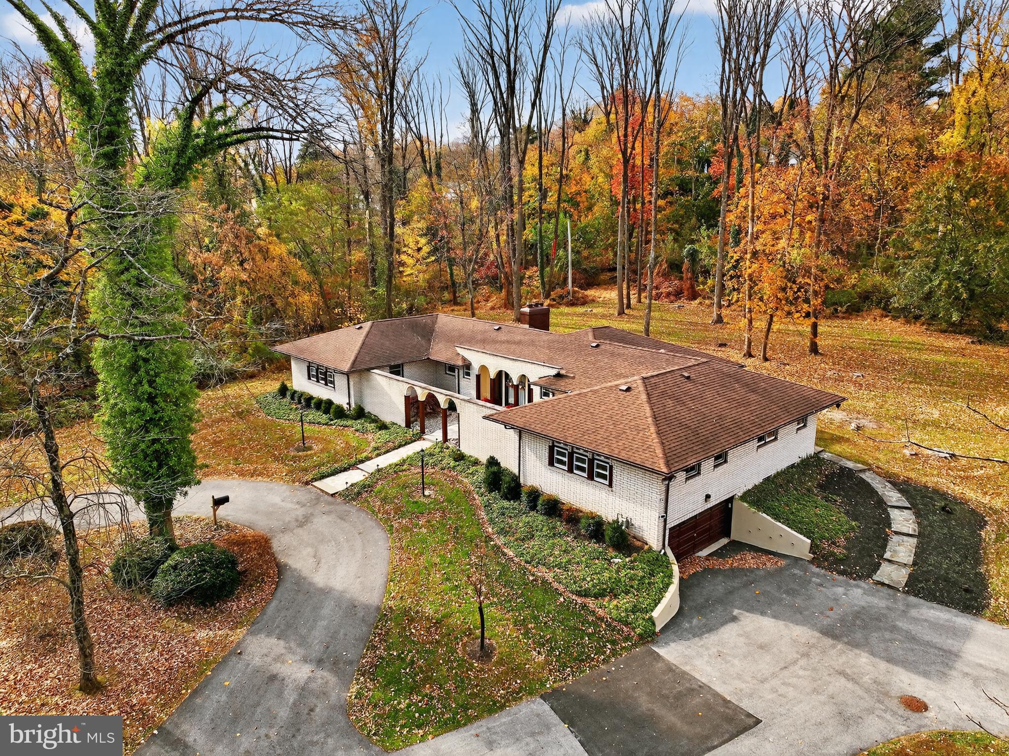 a view of a backyard with swimming pool