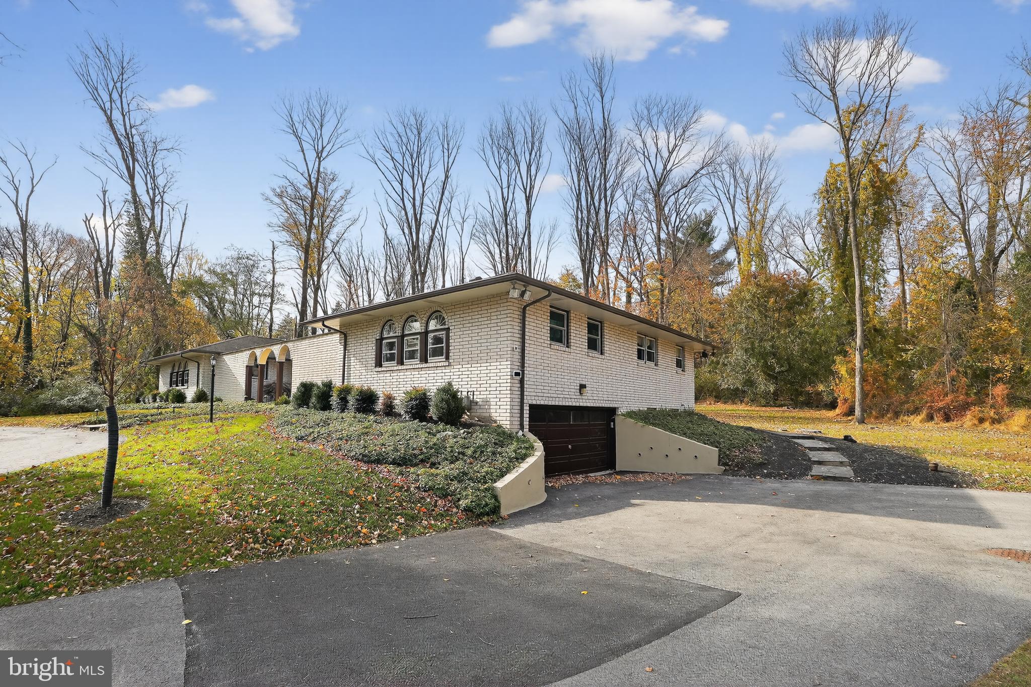 1013 Glen Road Wallingford, PA 19086 - Photo 13 of 45 a house that has a tree in front of it