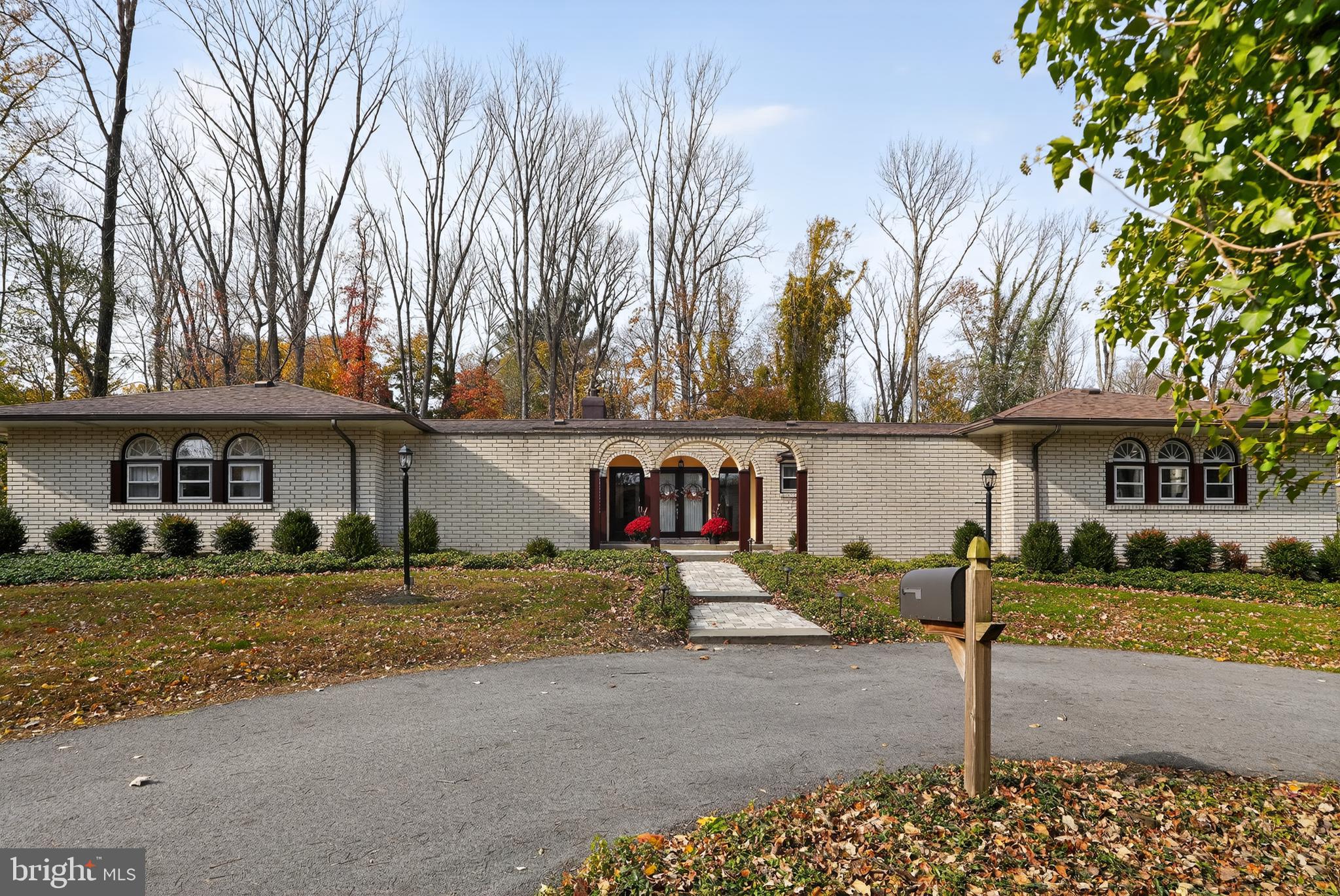 1013 Glen Road Wallingford, PA 19086 - Photo 14 of 45 a front view of a house with a yard and garage
