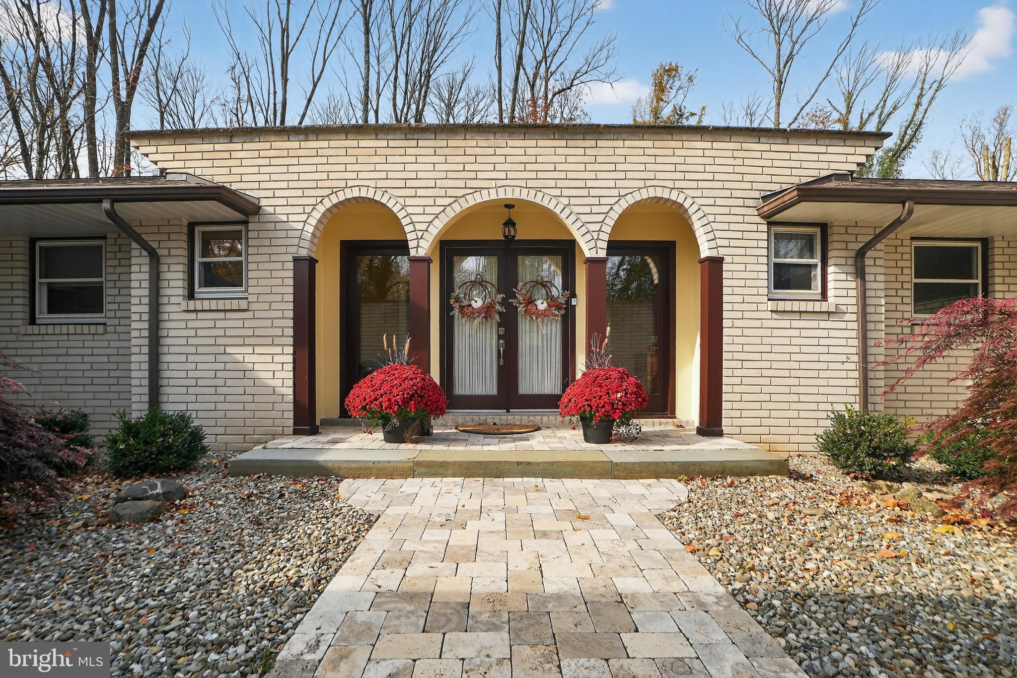 1013 Glen Road Wallingford, PA 19086 - Photo 15 of 45 a view of a house with large windows and potted plants