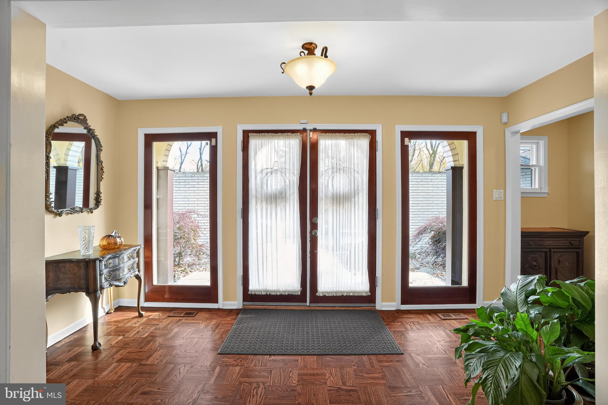 1013 Glen Road Wallingford, PA 19086 - Photo 17 of 45 a view of an entryway with a window and wooden floor